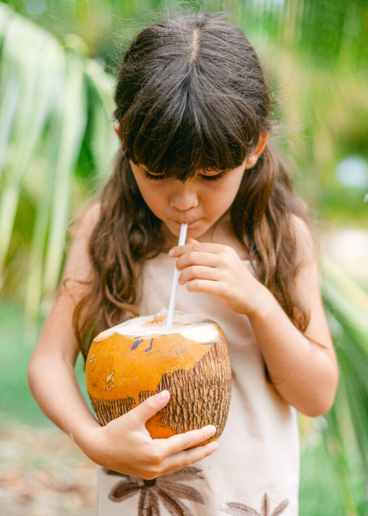 Sipping fresh coconut water at Punakea Farm Tour and Tasting on Maui